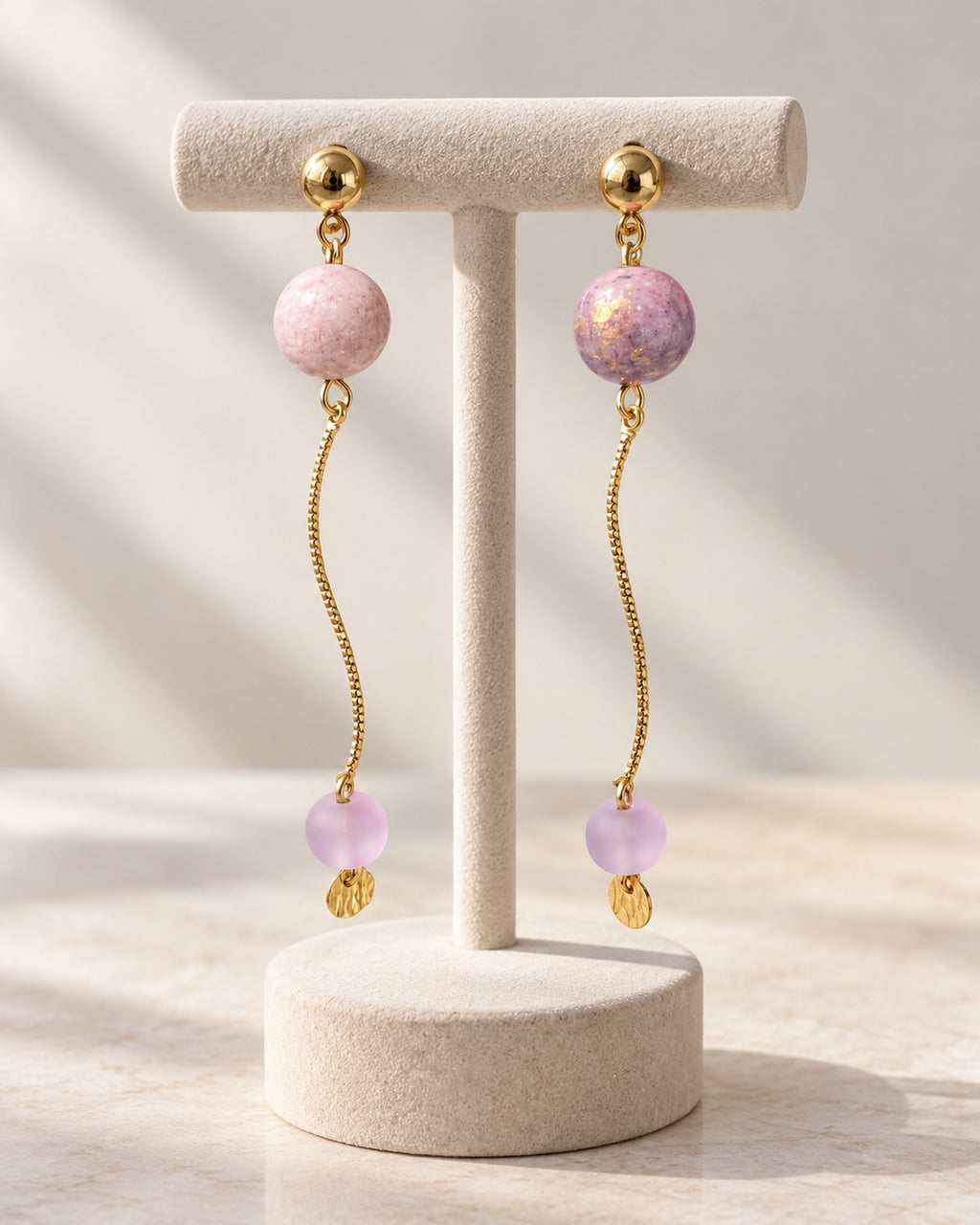 Lilac drop earrings on display stand