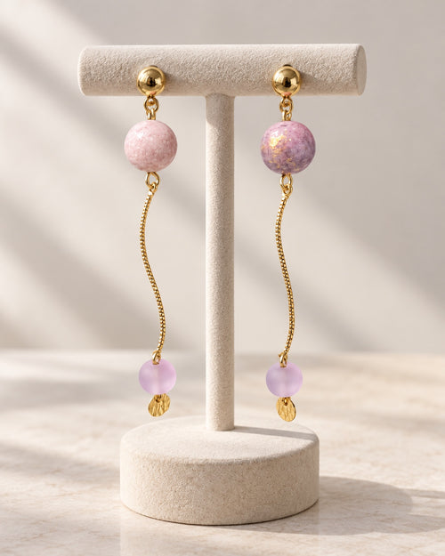 Lilac drop earrings on display stand