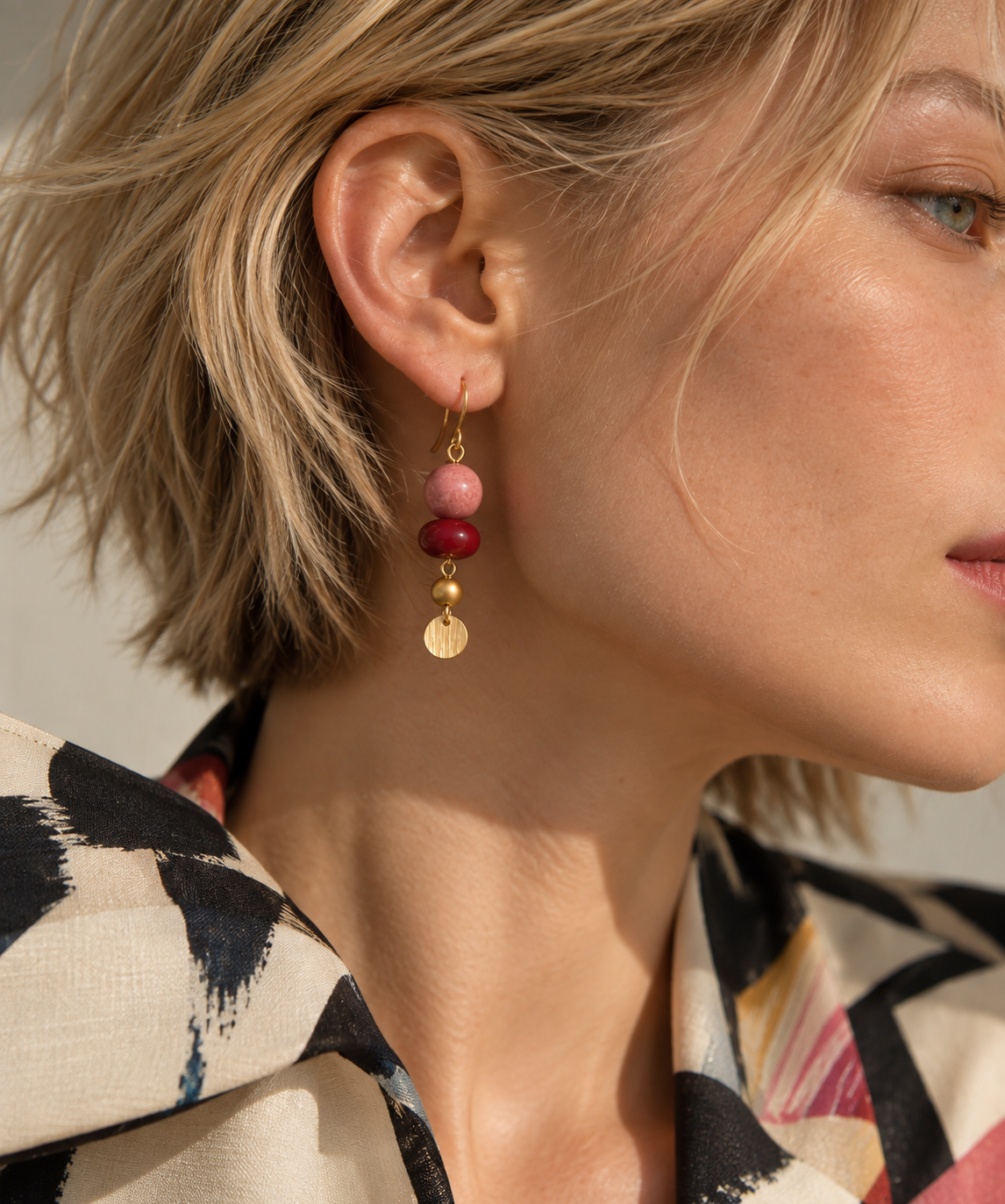 LULA Berry Pop Earrings worn on a model
