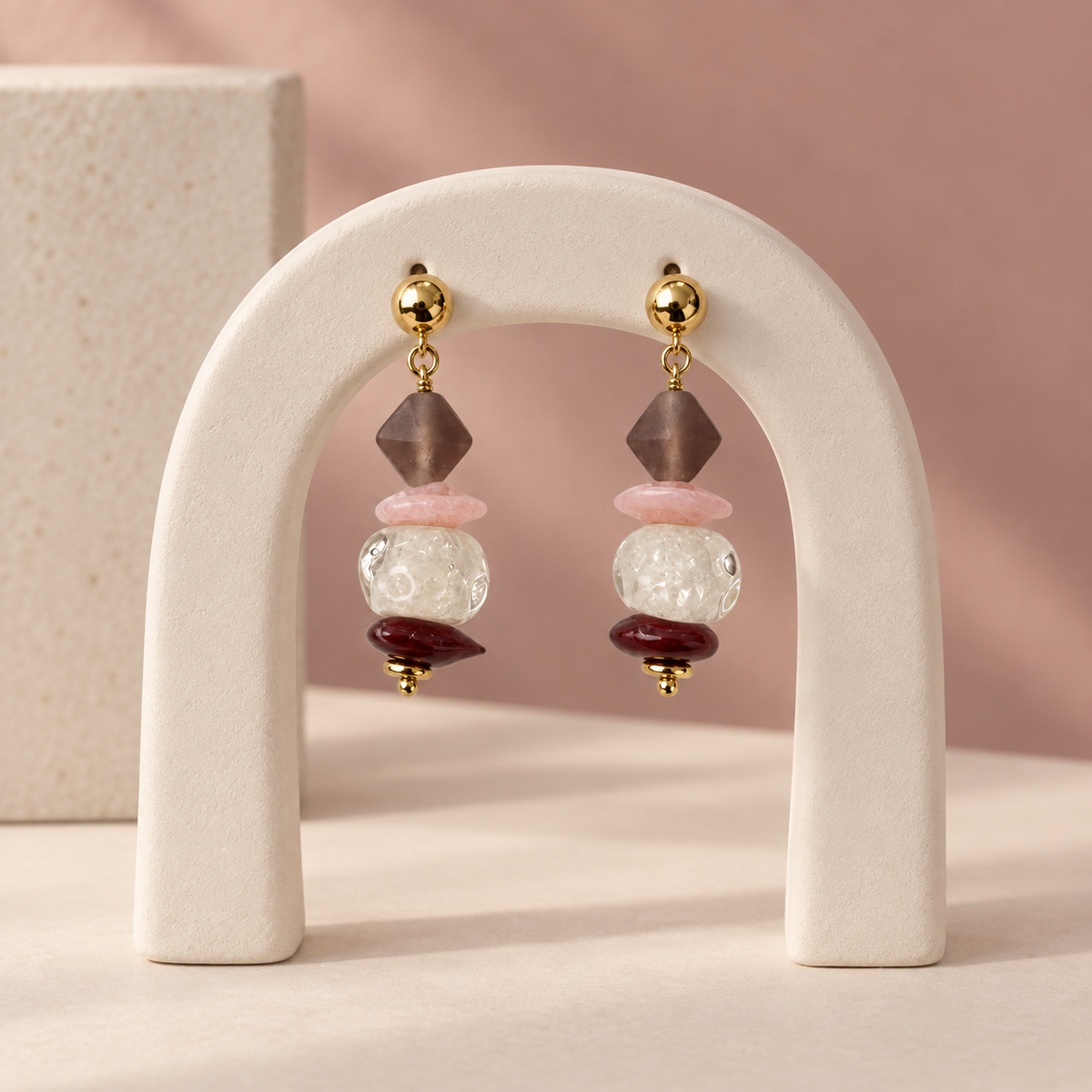 LULA Blush Stack handmade earrings on a sculptural display