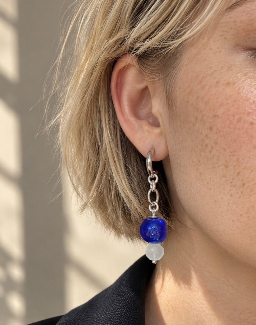 LULA Cobalt Drop Earrings worn on a model