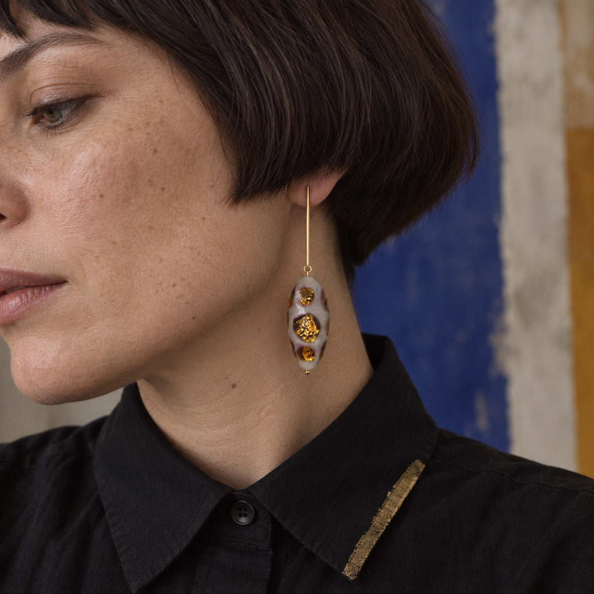 LULA Gilded Orbit handmade glass earrings worn by model