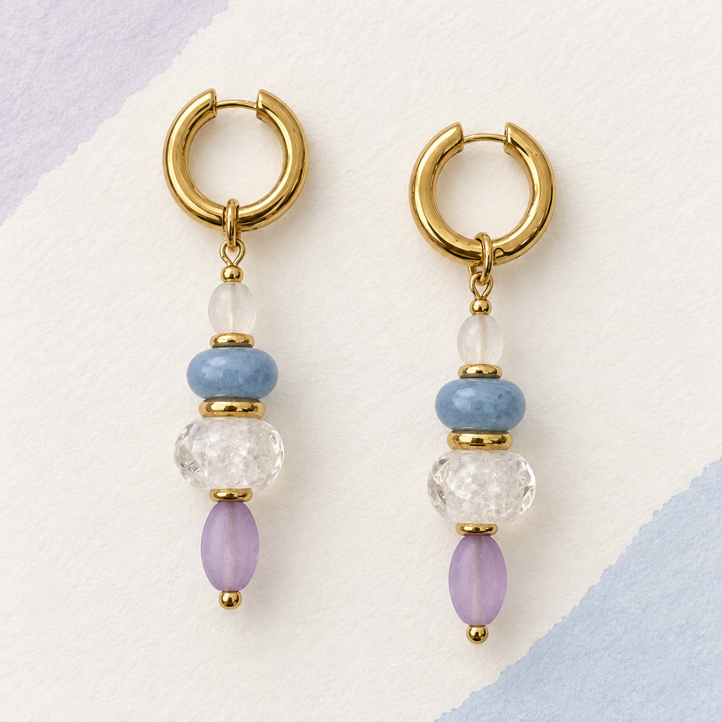 LULA Lilac Sky handmade earrings on a soft textured background