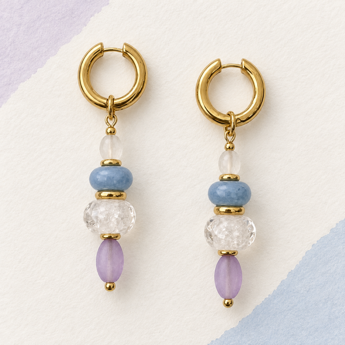 LULA Lilac Sky handmade earrings on a soft textured background