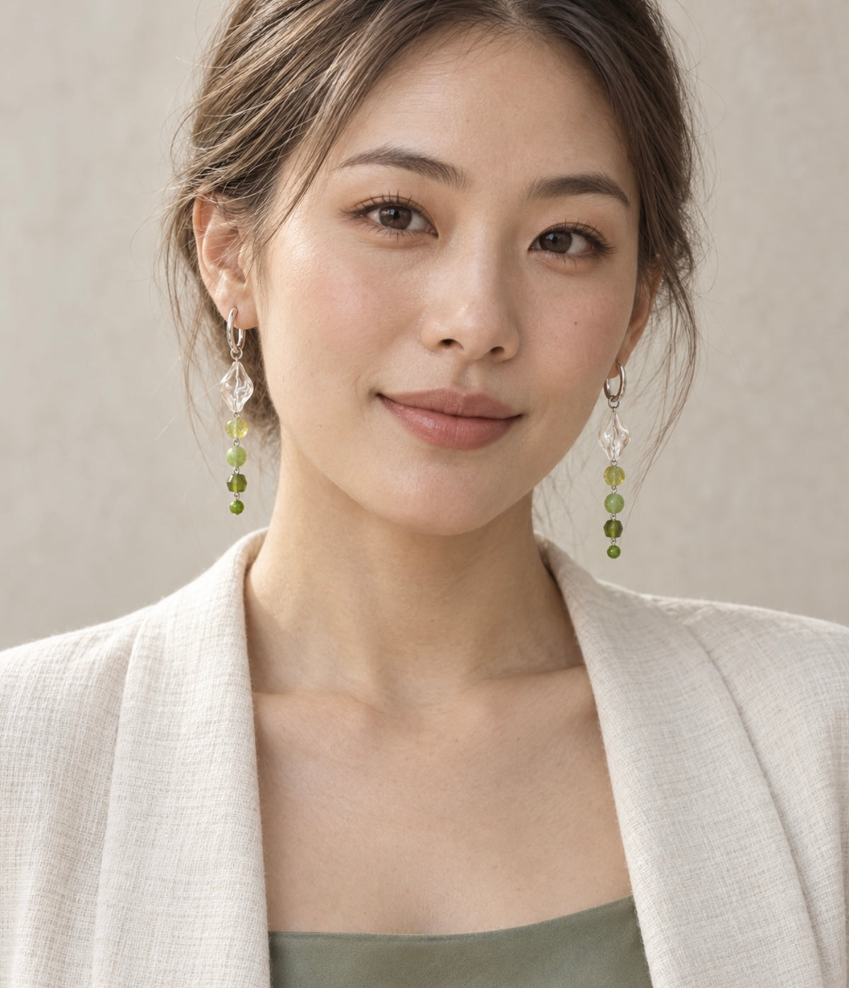 Model wearing LULA Moss Light green glass earrings