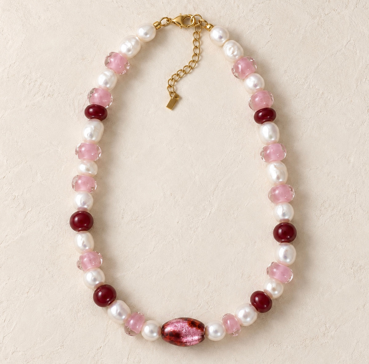 LULA Rosé necklace with irregular freshwater pearls, hand-formed pink glass beads, wine-red beads and a smooth central foil-glass bead
