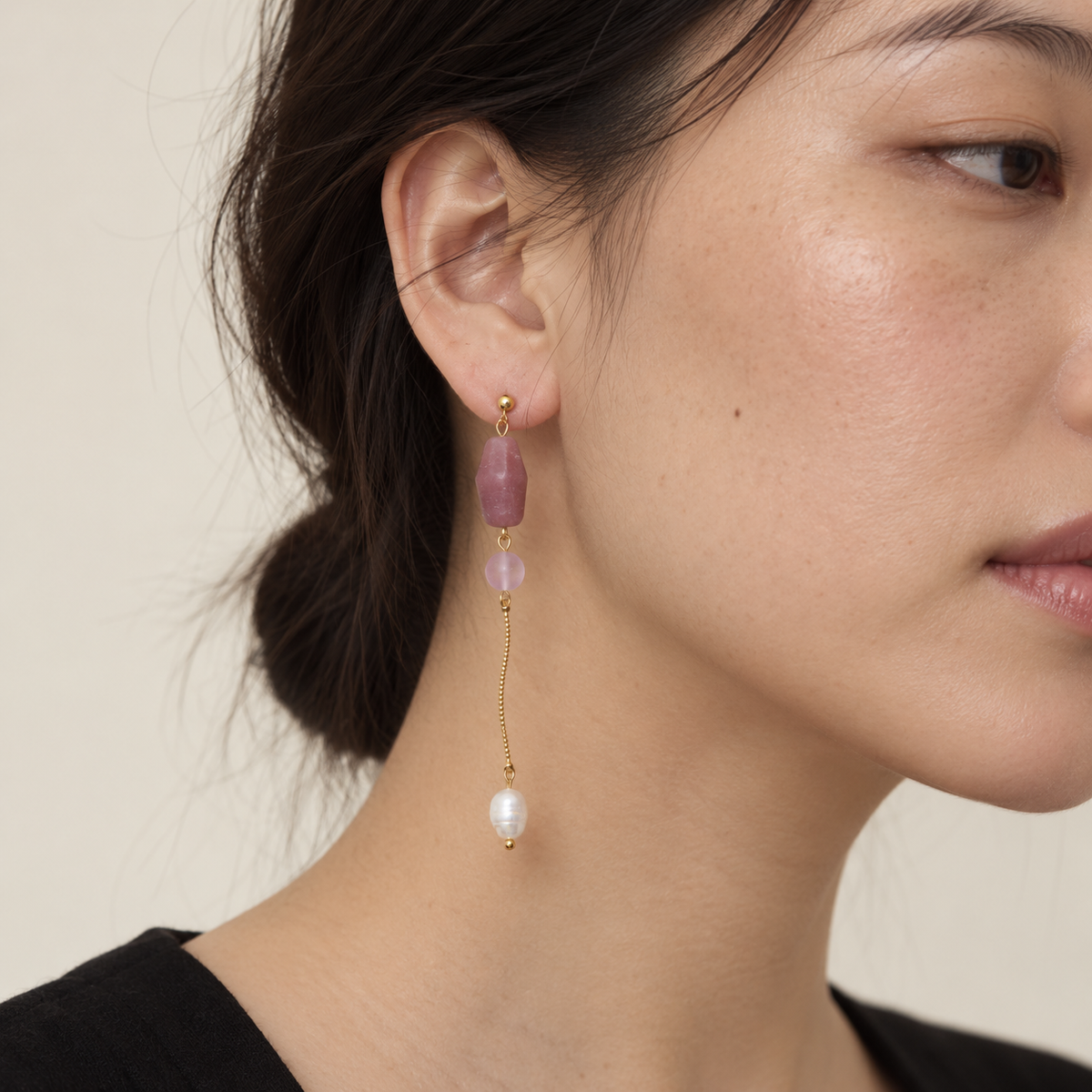 Model wearing LULA Rosée long pink glass and freshwater pearl earring